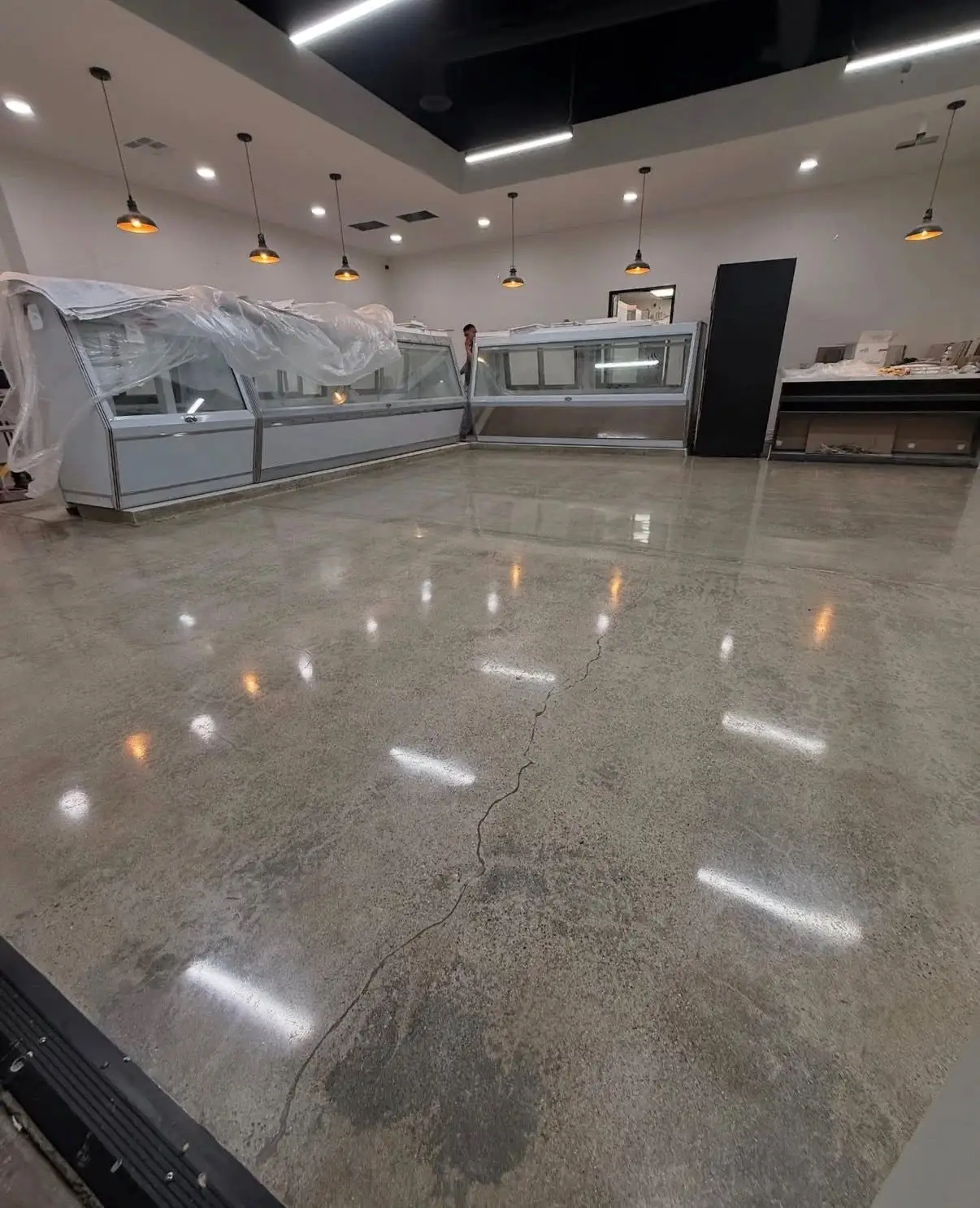 Polished concrete slab ground and densified to a reflective finish