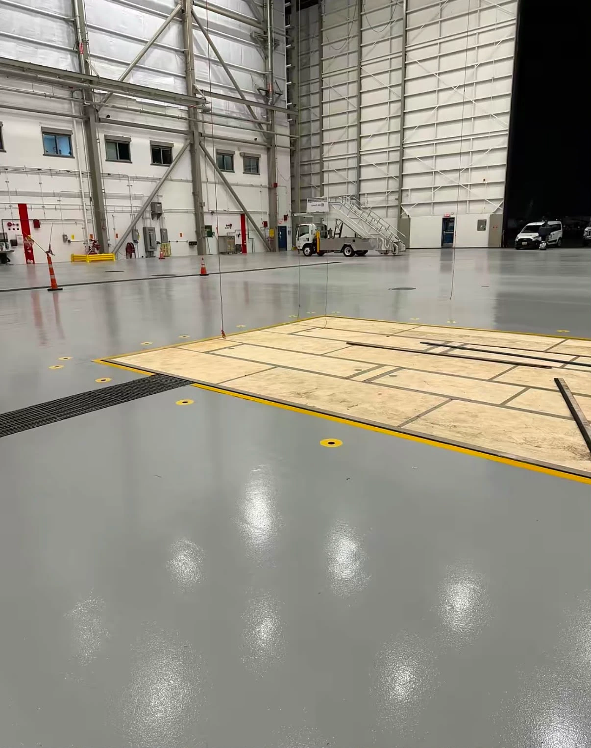 Coated aircraft hangar floor